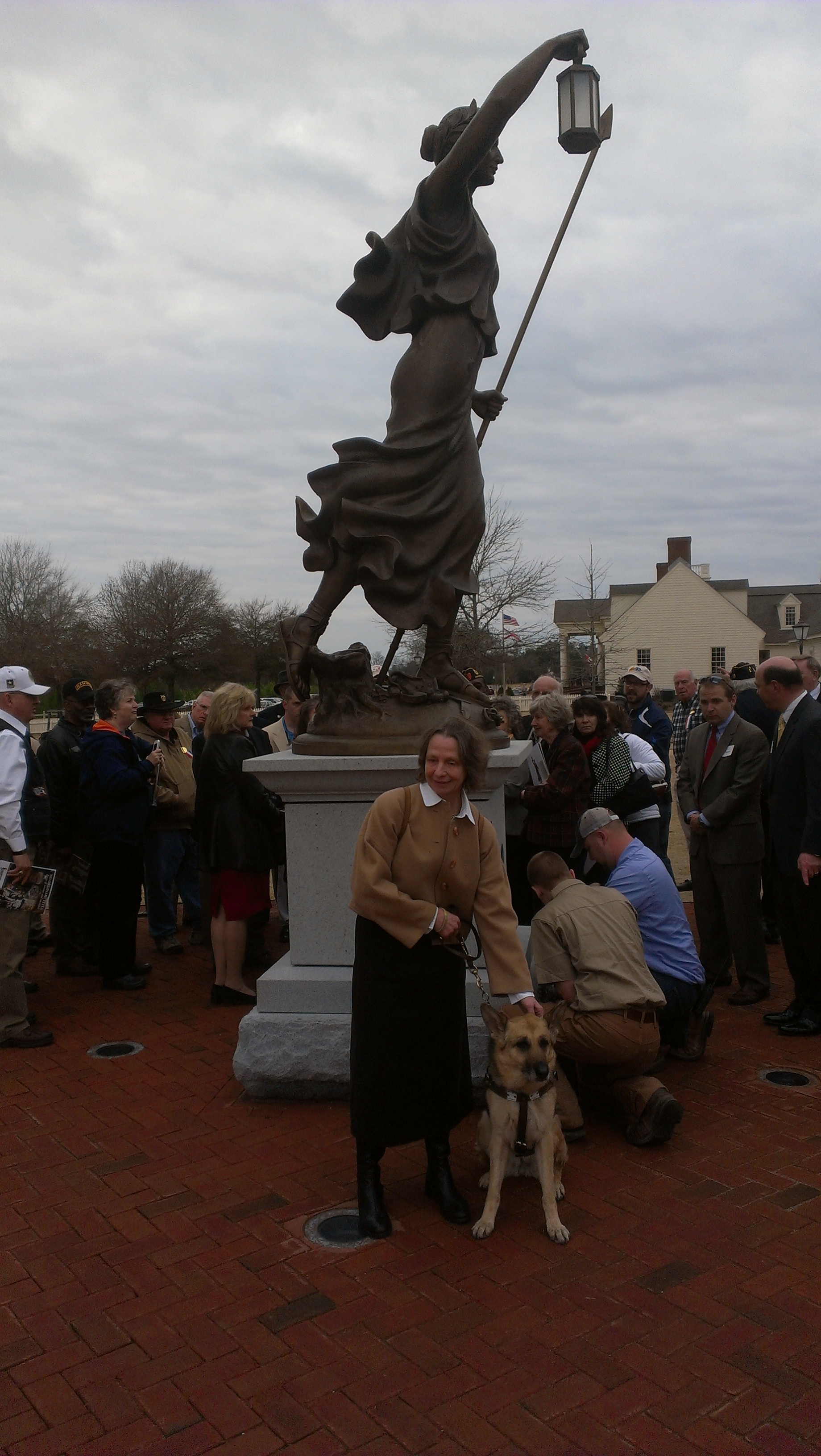 Sue Martin in front of Lady Liberty American Village Hallowed Ground